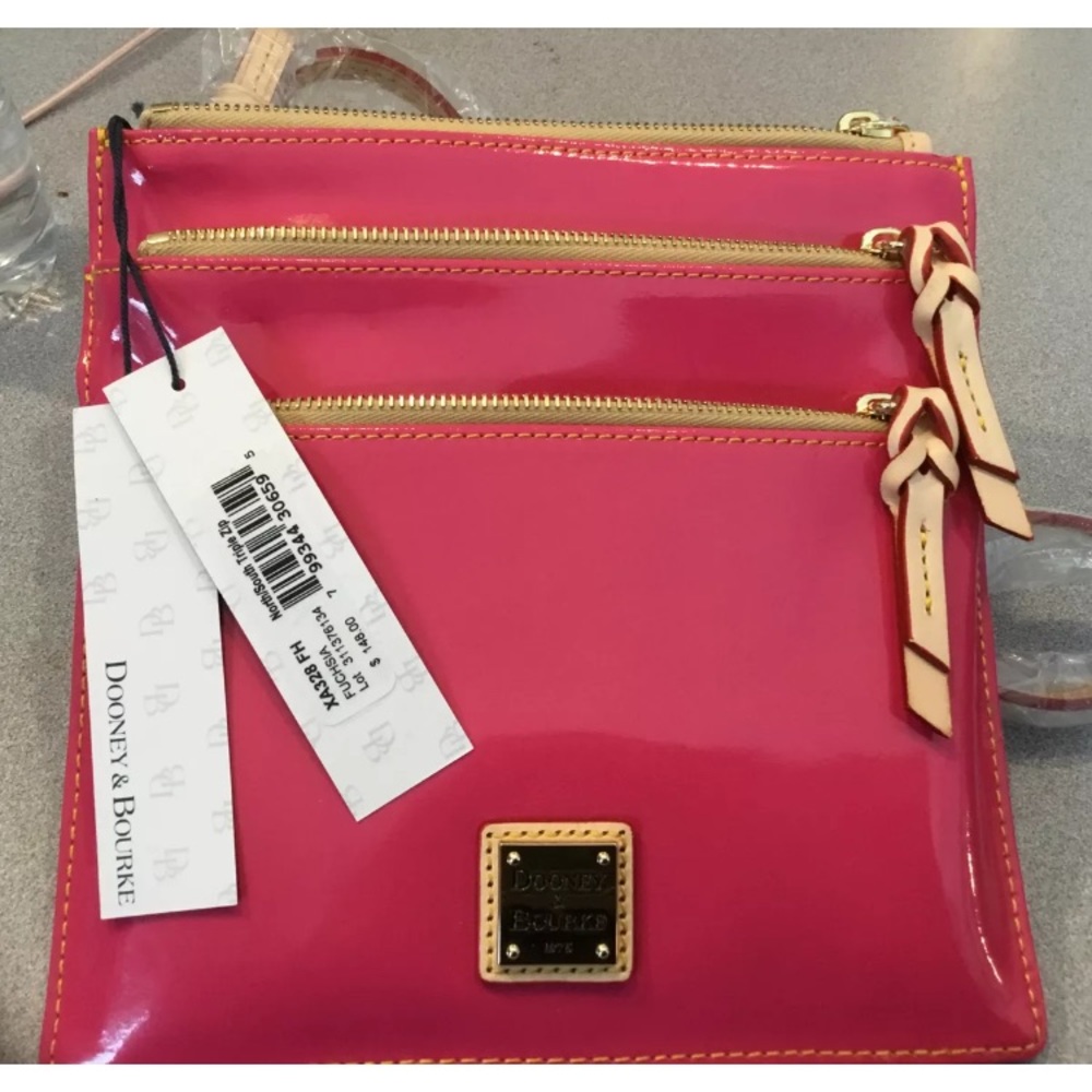 Dooney and Bourke patent leather 3 zipper crossove